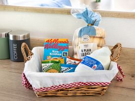 A basket containing breakfast items at Lido Leisure Park - Holiday Accommodation 19726 Knaresborough