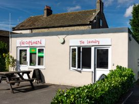 An outdoor area with signs for the cupboard and laundry at Lido Leisure Park - Holiday Accommodation 19726, Knaresborough