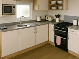 A kitchen with appliances and fixtures at Whitley Bay Holiday Park - Holiday Accommodation 19754, Whitley Bay