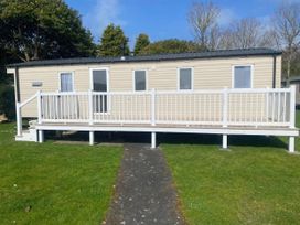 A holiday home with a deck and garden space at Hafan y Mor Haven - Holiday Accommodation 20501 Pwllheli