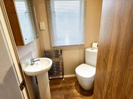 A bathroom with a sink and toilet at Thornwick Bay Holiday Village - Holiday Accommodation 20633, Flamborough