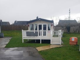 A holiday home with a deck at Marton Mere Holiday Village - Holiday Accommodation 20877 Blackpool