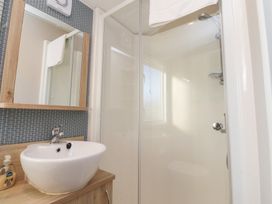 A bathroom with a sink and shower at Cala Gran Holiday Park - Holiday Accommodation 20962 Fleetwood