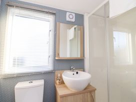 A bathroom with a sink, toilet, and shower at Cala Gran Holiday Park - Holiday Accommodation 20962, Fleetwood