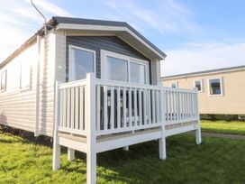 A holiday home with a deck at Cala Gran Holiday Park - Holiday Accommodation 20962 Fleetwood