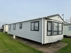 A static caravan with a number C43 outdoors at Whitehouse Leisure Park - Holiday Accommodation 21355 Towyn