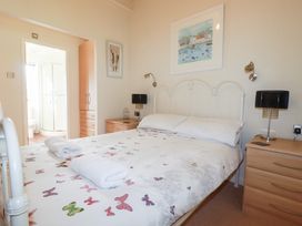 A bedroom with a bed and bedside lamps at St Minver Holiday Park - Holiday Accommodation 21443 Wadebridge