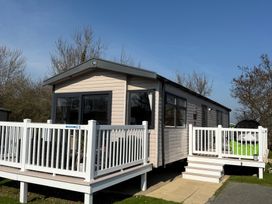 A holiday home with a deck and steps at Hafan y Mor Haven - Holiday Accommodation 22224 in Pwllheli