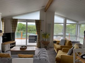 A living room with a sofa and coffee table at White Acres Holiday Park - Holiday Accommodation 22327 Whitecross, Newquay