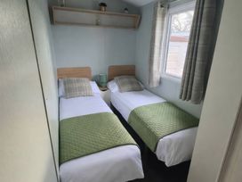 A bedroom with two single beds and a window at Butlins Minehead - Holiday Accommodation 22343, Minehead