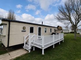 A caravan with decking and steps at Butlins Minehead - Holiday Accommodation 22343 Minehead