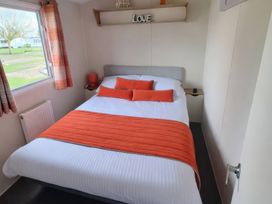 A bedroom with a bed and window at Butlins Minehead - Holiday Accommodation 22343 Minehead