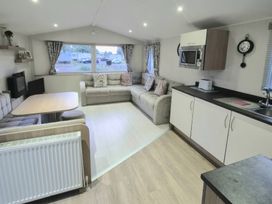 A living room with a sofa and dining table at Butlins Minehead - Holiday Accommodation 22343 Minehead