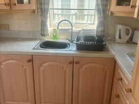 a kitchen with a sink and countertop at Coral Beach - Holiday Accommodation 22375 in Ingoldmells