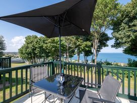 An outdoor seating area with a table and chairs at St Andrews Holiday Park - Holiday Accommodation 2944, St Andrews