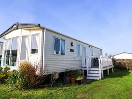 A holiday home with decking and garden at Beachcombers in Wareham