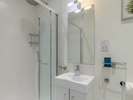 A bathroom with a shower and sink at Lakeside Studio Portreath