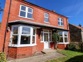 A red brick house with front garden at 22 The Lane Saltburn-by-the-Sea