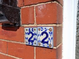Number tiles on a brick wall at 22 The Lane Saltburn-by-the-Sea