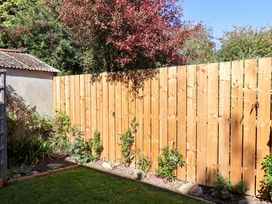 A garden with a wooden fence and plants at 22 The Lane, Saltburn-by-the-Sea