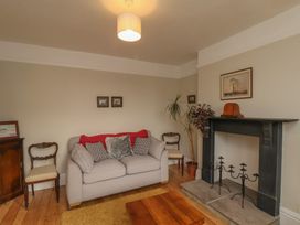 A living room with a sofa and coffee table at The Manse in Whitby