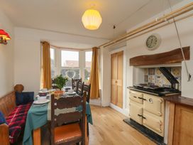 A dining room with a table and chairs at The Manse in Whitby