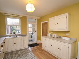 A kitchen with cabinets and appliances at The Manse in Whitby