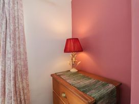 A lamp on a dresser in a bedroom at The Manse in Whitby