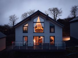 A house with windows and a balcony at Ferry Hills in Laugharne
