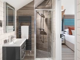A bathroom with shower and basin at Ferry Hills in Laugharne