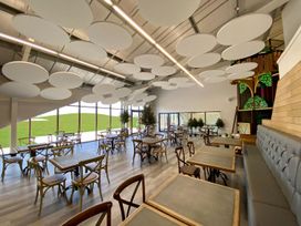 A dining room with tables and chairs at Darwin Retreat in Aspatria