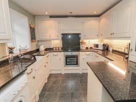 A kitchen with countertops and appliances at 21 High Street Scarborough