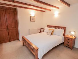 A bedroom with a bed and nightstand at 21 High Street, Scarborough
