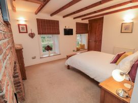 A bedroom with a bed and nightstand at 21 High Street, Scarborough