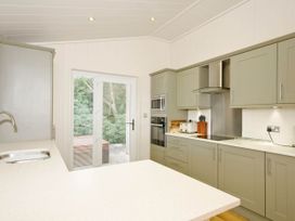 A kitchen with cabinets and appliances at Lawson in Wigton