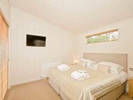 A bedroom with a bed and television at Lawson in Wigton