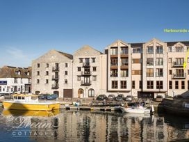 A building with apartments and boats at Harbourside Apartment Weymouth