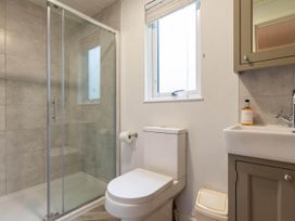 A bathroom with a shower, toilet, and sink at Wensleydale in Aysgarth