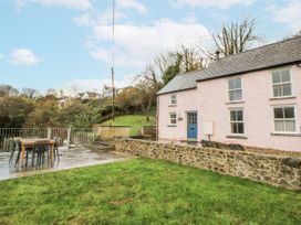 A house with a patio and garden area at Fronglyd in Aberporth