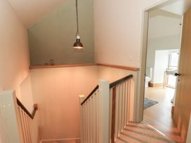 A staircase leading to a bathroom at Fronglyd Aberporth