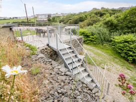 Steps leading to a patio area at Fronglyd in Aberporth