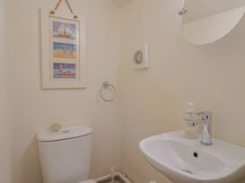 A bathroom with toilet and sink at Vine Cottage in Burton Bradstock