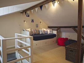 A loft area with a daybed and beanbags at St Leonards in Salcombe