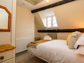 A bedroom with a bed and window at 29 Spring Street Chipping Norton