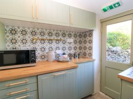 A kitchen with a microwave and kettle at 29 Spring Street Chipping Norton