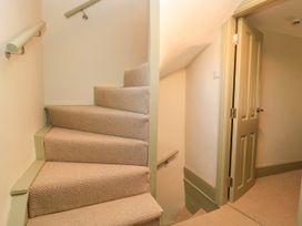 A staircase with a handrail at 29 Spring Street in Chipping Norton