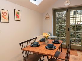 A dining room with a table and chairs at 6 Priory Lane Burford