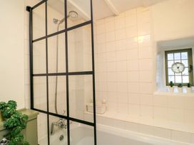 A bathroom with a shower and bathtub at 6 Priory Lane Burford