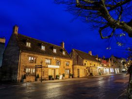 A street view with buildings and trees at 6 Priory Lane Burford
