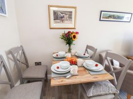 A dining room with a table set for breakfast at Farriers Yard Whitby